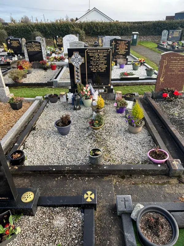 Before restoration image showing a weathered headstone prior to professional cleaning and restoration by AD Rennicks Memorials in Offaly.