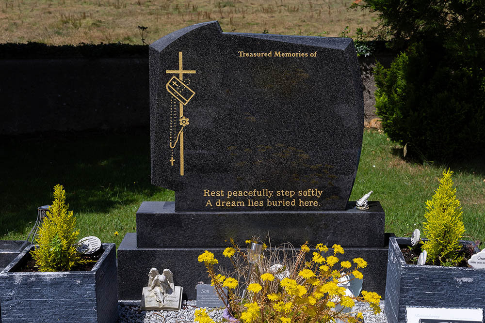 Newly installed granite memorial by AD Rennicks Memorials, securely fitted and aligned with care.